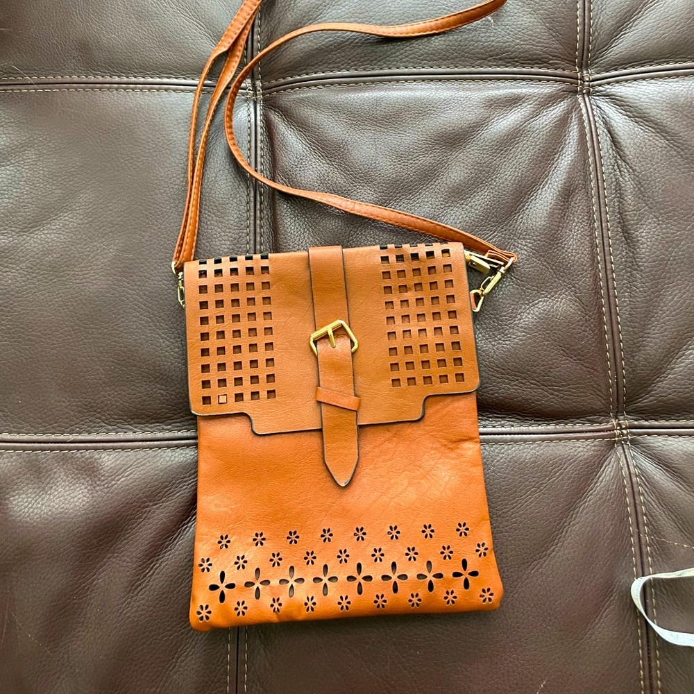 Dark brown laser cut vegan leather crossbody bag